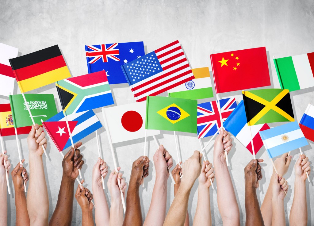 Diversity of Hands Holding National Flags